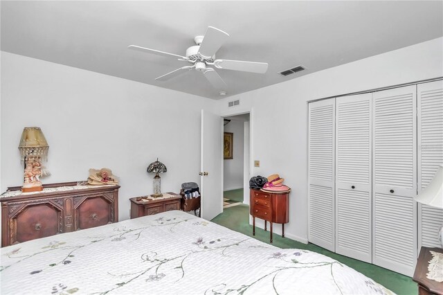 bedroom with ceiling fan, a closet, and carpet flooring