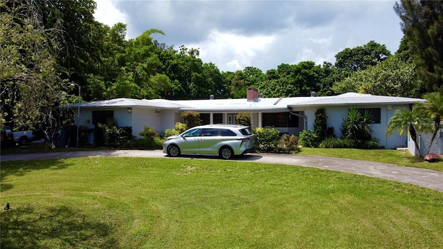 ranch-style house with a front yard