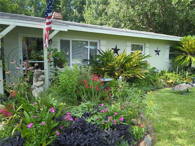 view of property exterior featuring a lawn