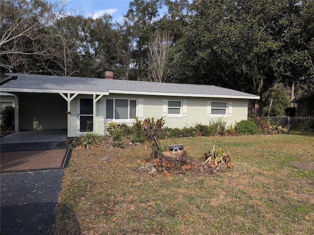 single story home with a carport and a front yard