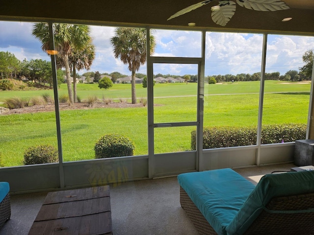 sunroom / solarium with ceiling fan and plenty of natural light