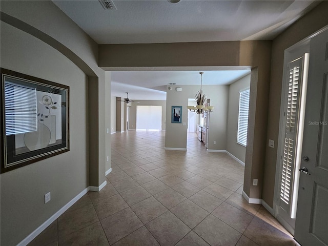 hall featuring tile patterned floors