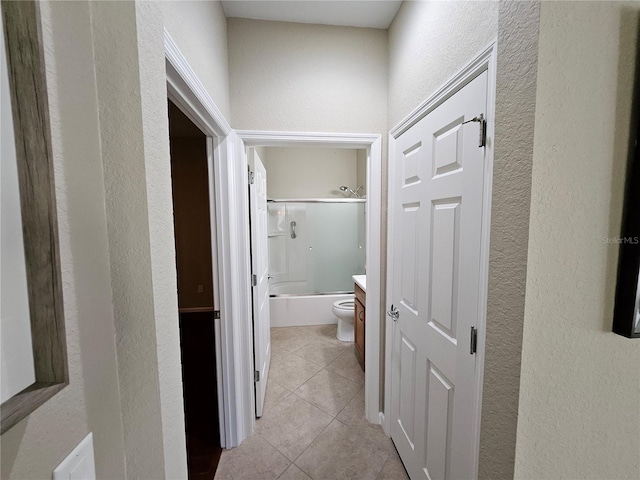 hallway featuring light tile patterned floors