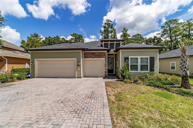 prairie-style house featuring a garage