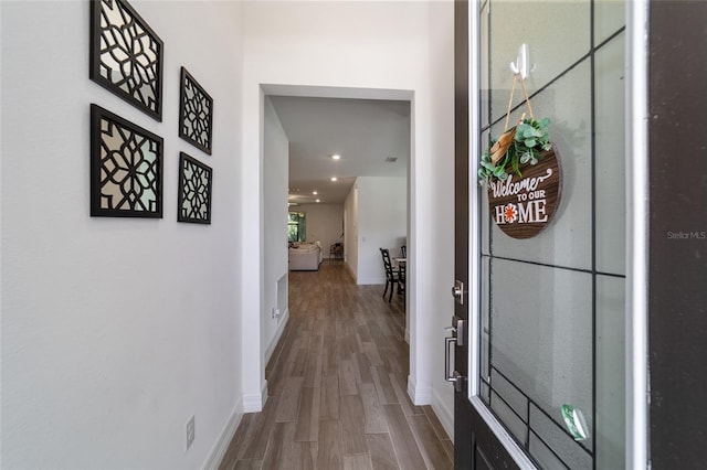 hallway featuring wood-type flooring