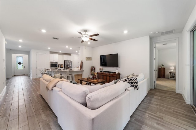 living room featuring ceiling fan