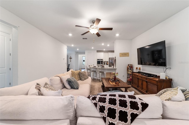 living room with ceiling fan