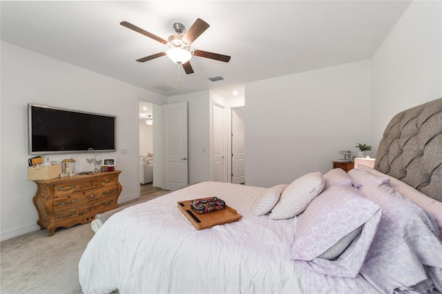 bedroom featuring ceiling fan and light carpet