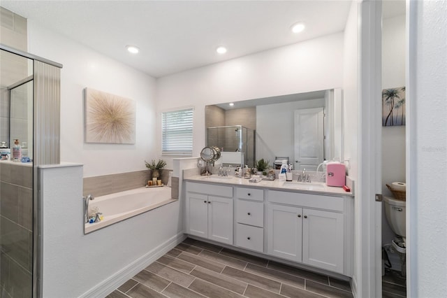 full bathroom featuring toilet, vanity, and plus walk in shower