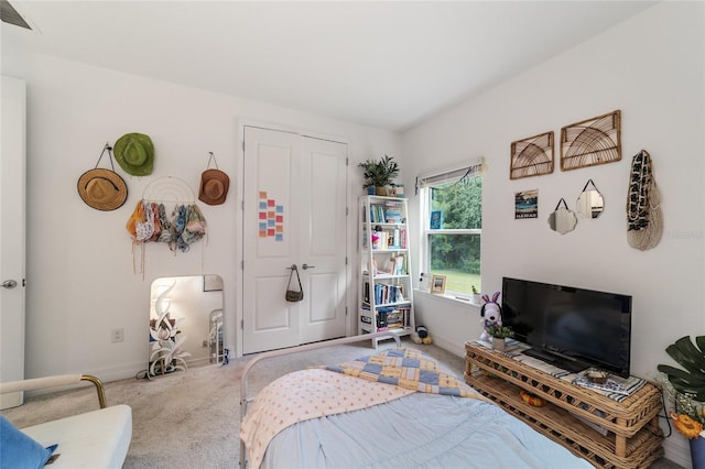 bedroom featuring a closet and carpet flooring