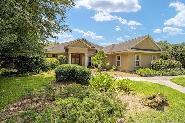 single story home with a front yard