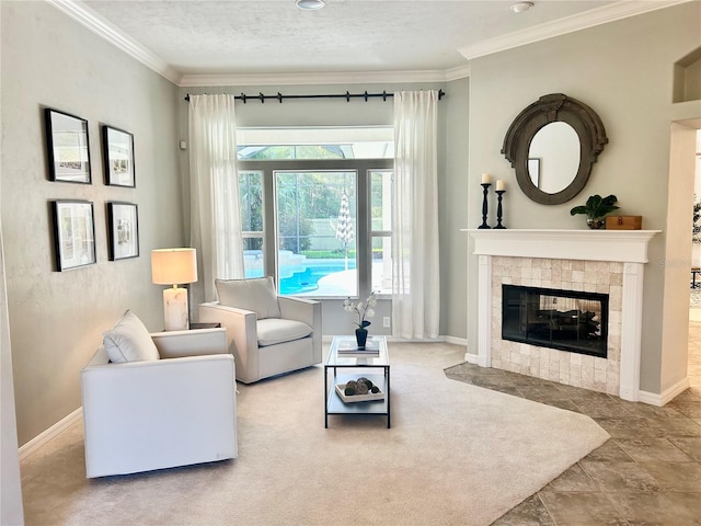 living room featuring a textured ceiling, ornamental molding, a fireplace, and baseboards