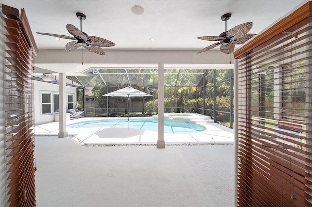 view of swimming pool featuring ceiling fan, a patio, and glass enclosure