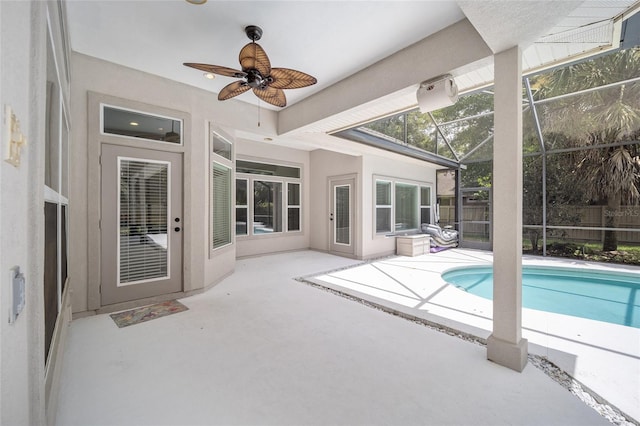 exterior space with a lanai, a fenced in pool, a ceiling fan, and a patio