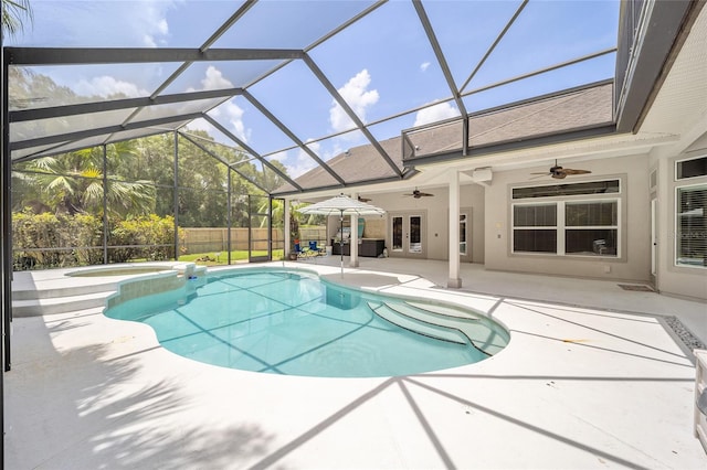 view of swimming pool featuring ceiling fan, glass enclosure, fence, french doors, and a patio area