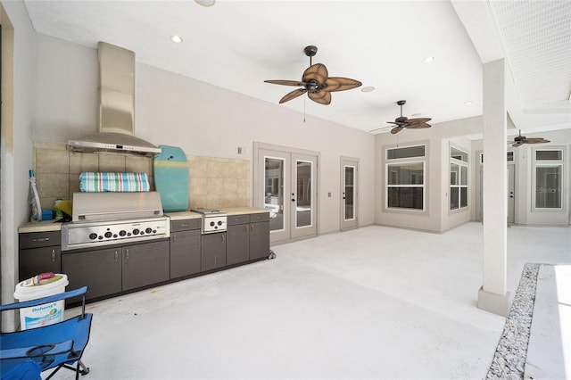 view of patio / terrace featuring ceiling fan, french doors, grilling area, and exterior kitchen