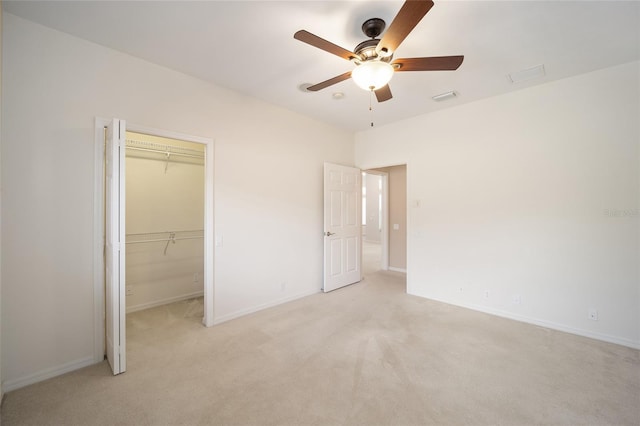 unfurnished bedroom featuring baseboards, a closet, visible vents, and light colored carpet