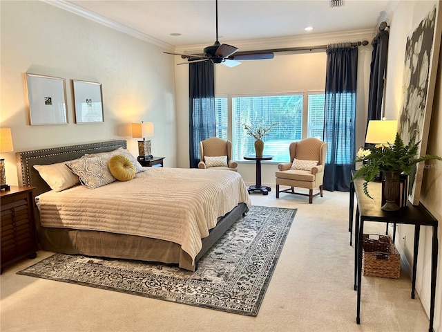 bedroom featuring light carpet, visible vents, a ceiling fan, and crown molding