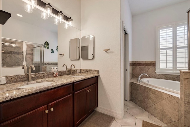 bathroom with tile patterned flooring, vanity, and independent shower and bath