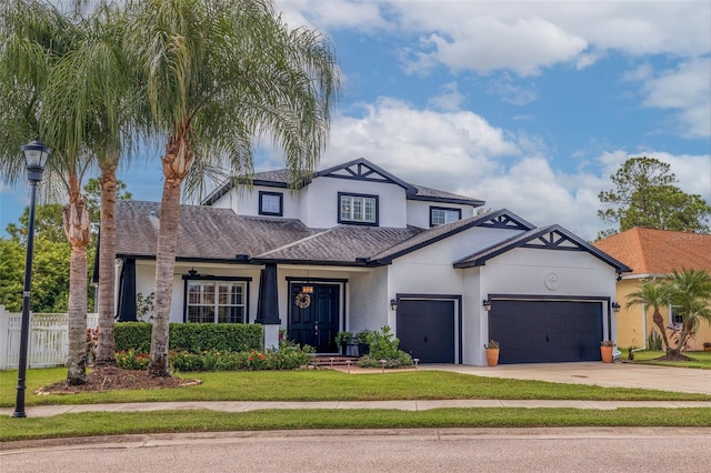 view of front of property with a garage and a front yard