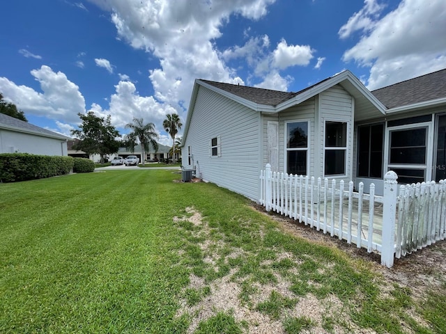 view of property exterior with a lawn