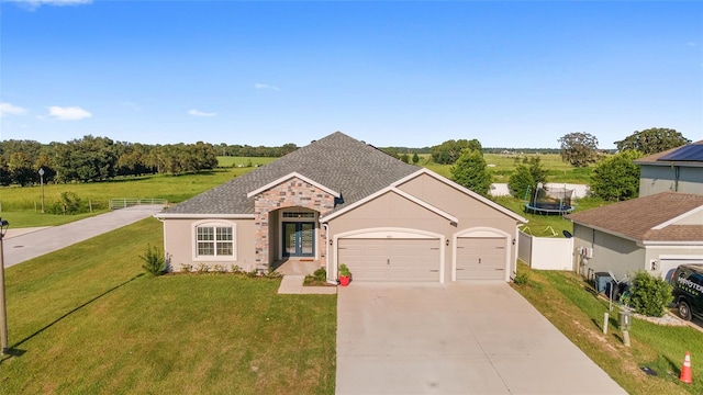 view of front of home featuring a garage and a front lawn