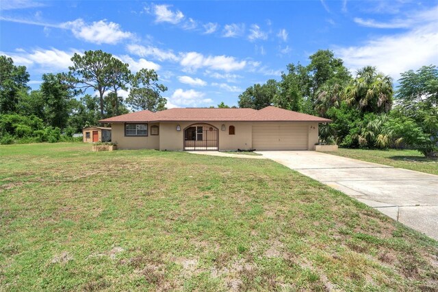 single story home featuring a garage and a front yard