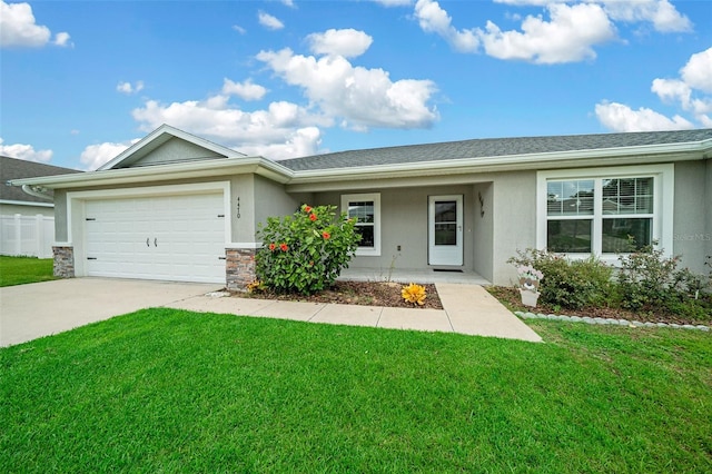 single story home with a garage and a front lawn