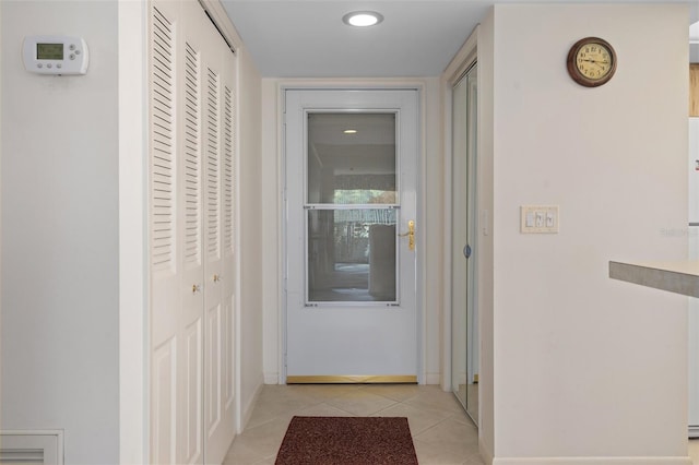 corridor with light tile patterned floors