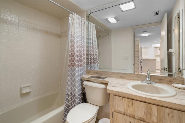 full bathroom with vanity, toilet, and shower / bath combo