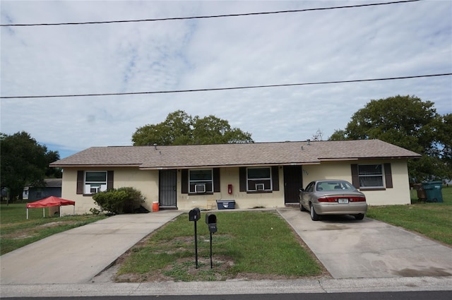 ranch-style house featuring a front lawn