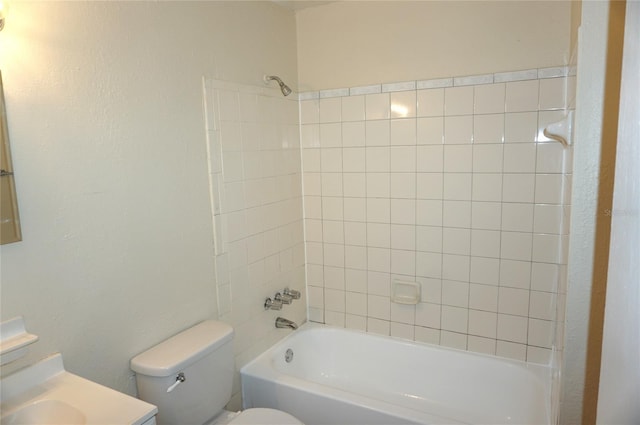 bathroom with shower / tub combination, vanity, and toilet