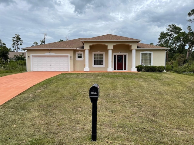 view of front facade featuring a front lawn and a garage