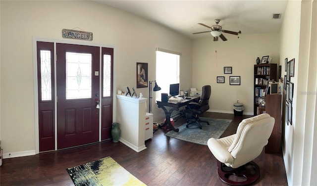 foyer entrance with ceiling fan and dark wood-type flooring