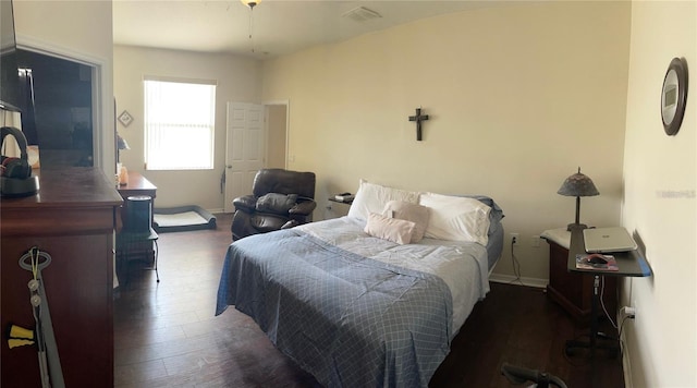 bedroom featuring dark hardwood / wood-style flooring