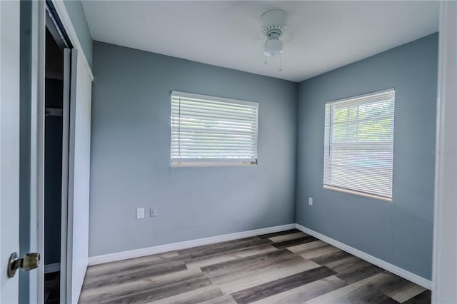 unfurnished bedroom featuring a closet and wood-type flooring