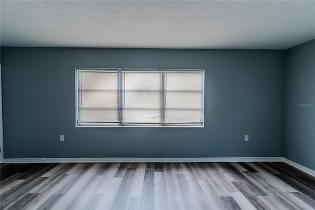 empty room featuring hardwood / wood-style floors