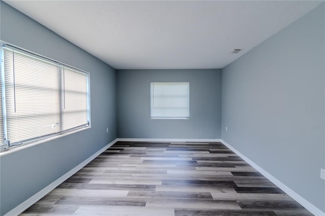 spare room with hardwood / wood-style flooring