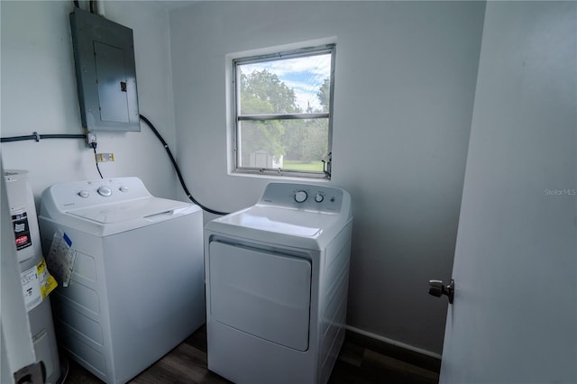 laundry area with electric water heater, dark wood-type flooring, washer and dryer, and electric panel