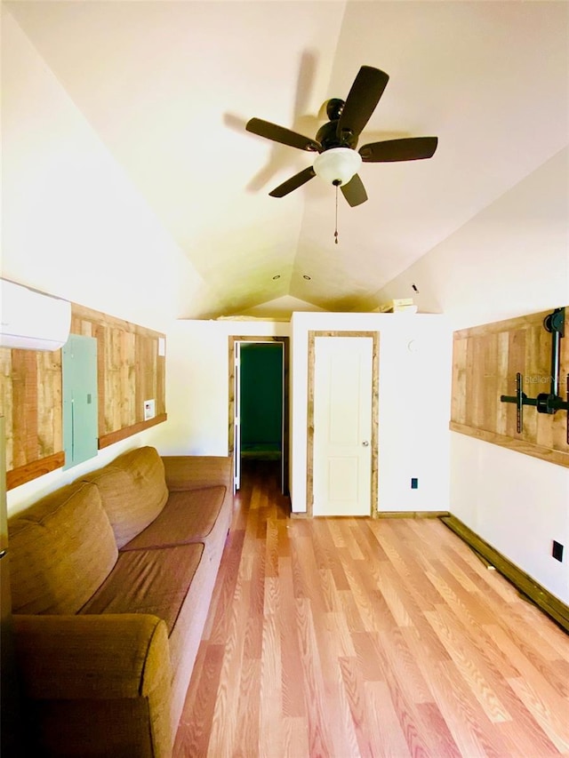 sitting room with light hardwood / wood-style flooring, ceiling fan, and vaulted ceiling