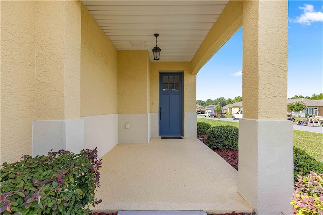 doorway to property with a patio area