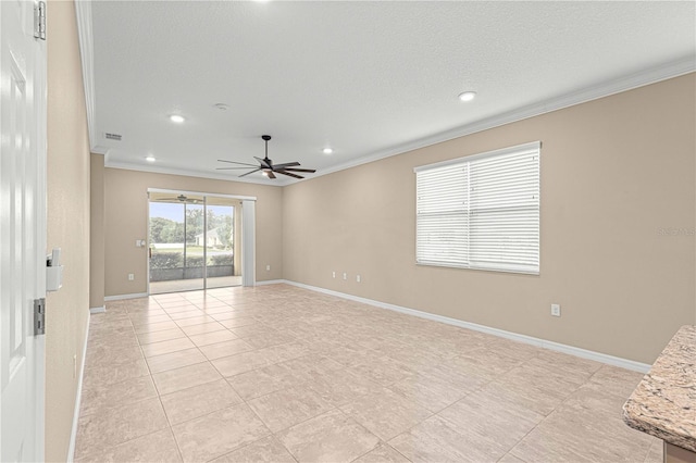 tiled spare room with a textured ceiling, ornamental molding, and ceiling fan