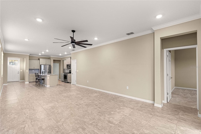 unfurnished living room featuring ceiling fan and ornamental molding