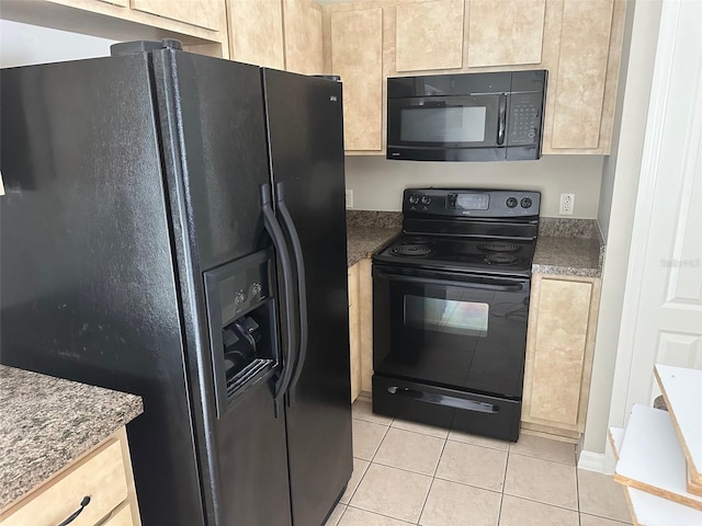 kitchen with light tile patterned flooring, black appliances, and light brown cabinetry