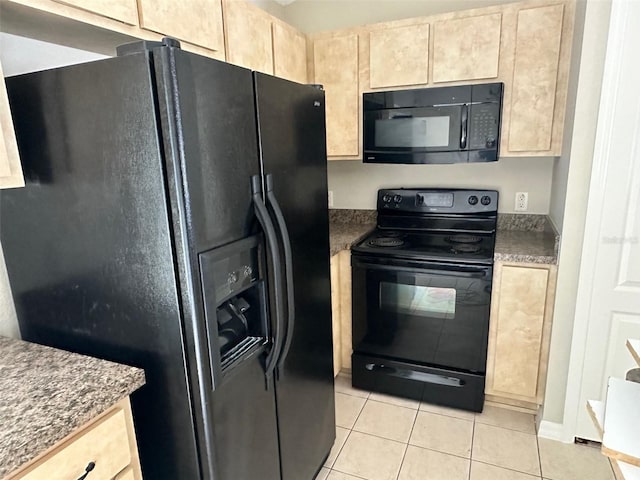 kitchen with black appliances, light brown cabinets, and light tile patterned floors