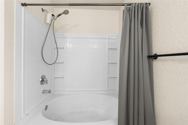 bathroom with shower / bath combination with curtain