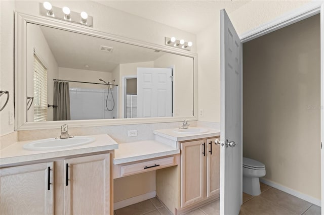 bathroom featuring tile patterned floors, vanity, toilet, and a shower with shower curtain