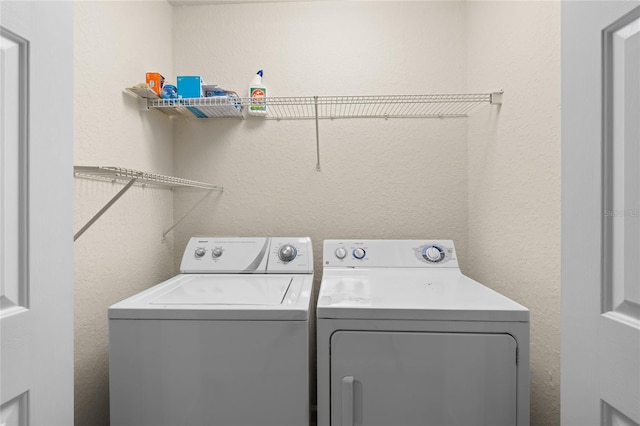 washroom featuring independent washer and dryer