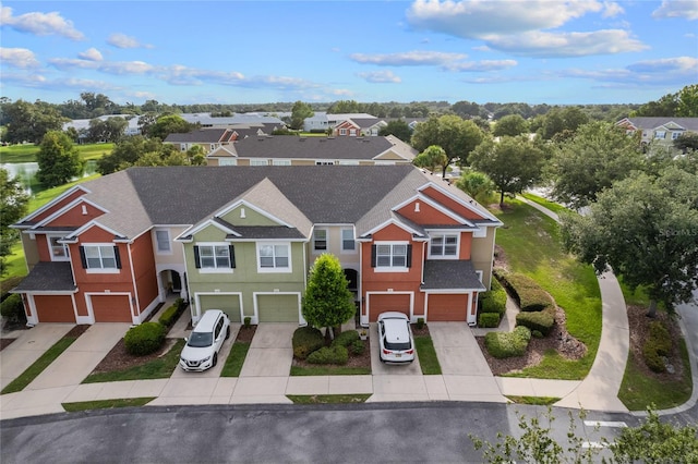 birds eye view of property with a residential view