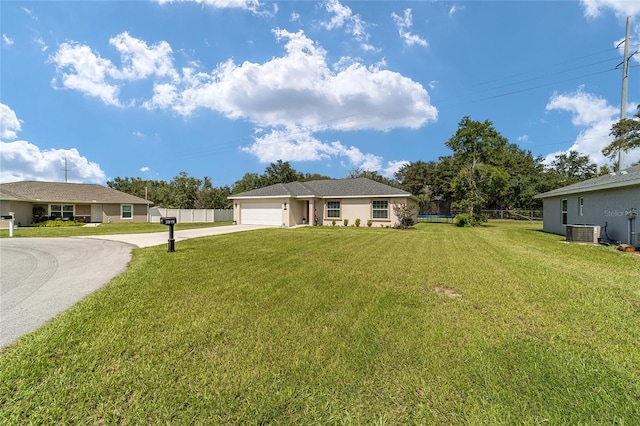 single story home featuring a front yard, central AC unit, and a garage